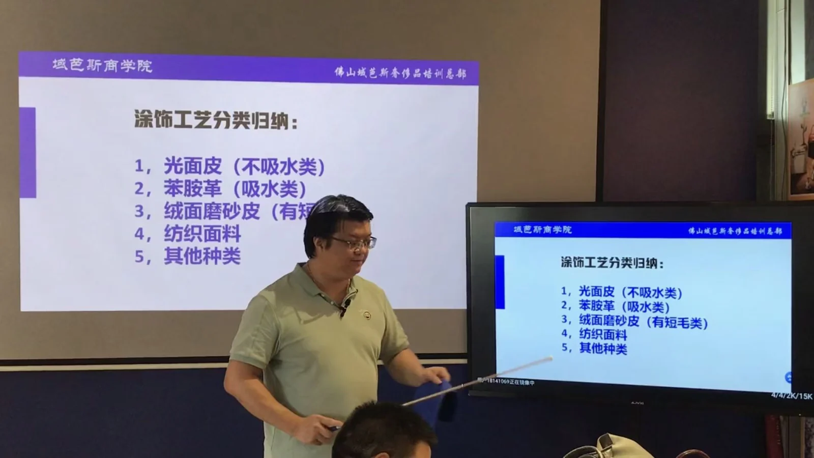 An instructor teaching with materials and diagrams