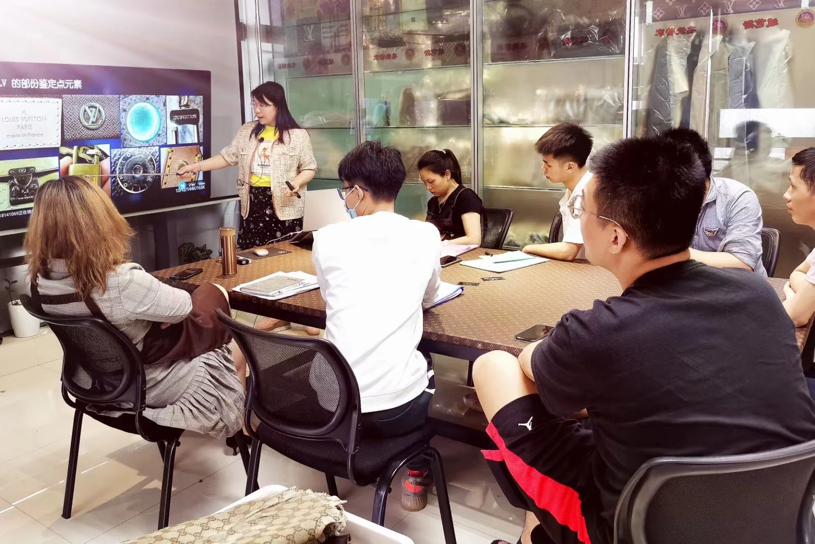 An instructor and students discussing a topic